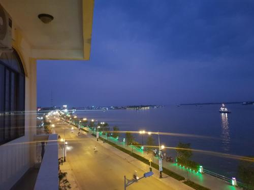 a view of a city street at night with lights at Rang Dong Hotel in My Tho