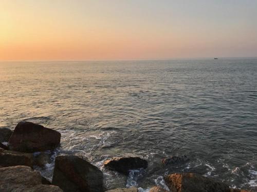 a group of rocks on the shore of the ocean at Sealife Private Beach Villa in Ban Nong Si Tong
