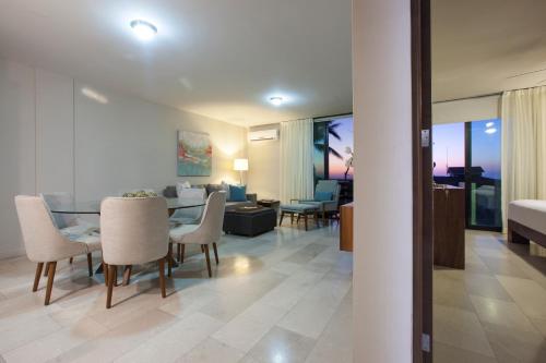 a living room and dining room with a table and chairs at Departamentos San José in La Paz