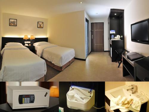 Pokój hotelowy z 2 łóżkami i łazienką w obiekcie ERNES Hotel w mieście Perai