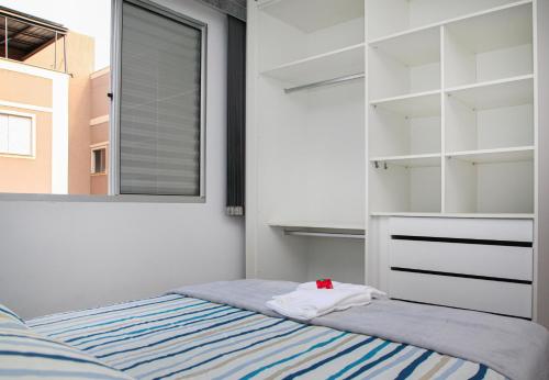 A bed or beds in a room at Apartamento Aeroporto/ Uniube