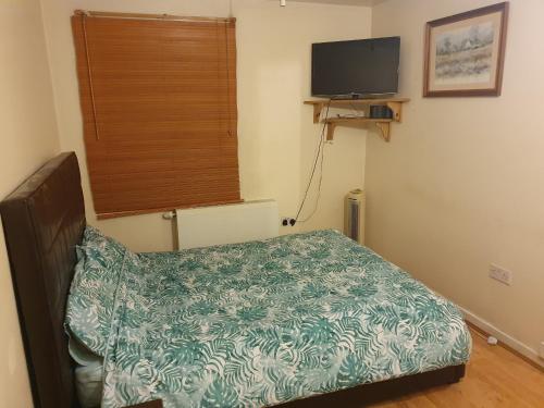Кровать или кровати в номере Olympus Apartment