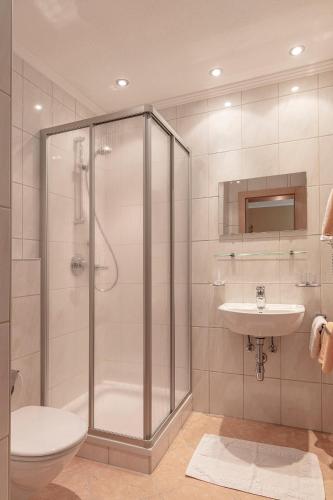 a bathroom with a shower and a toilet and a sink at Appartement MonAlisa in Sölden