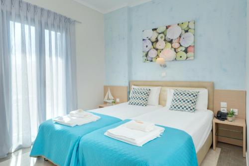 Pyrgos Beach Hotel Apartmentsにあるベッド