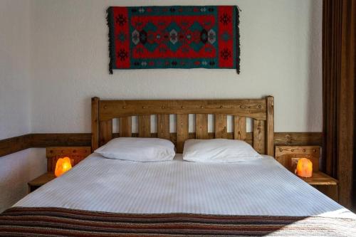 מיטה או מיטות בחדר ב-Rahat Hotel