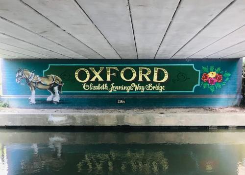 a sign with a horse standing under a bridge at Marlborough House - Guest House in Oxford
