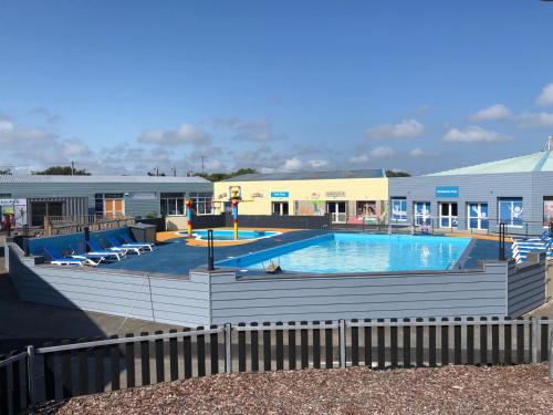 a large swimming pool in front of a building at The Lizard Bluewater in Helston