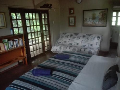 Una cama o camas en una habitación de Hippo Retreat & Tiger Fishing Komatipoort