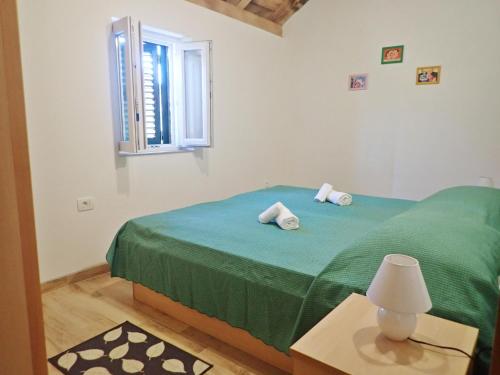 Posteľ alebo postele v izbe v ubytovaní Mareta - Apartment in a stone house