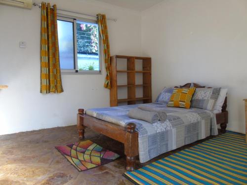 Postel nebo postele na pokoji v ubytování IDC Guest House