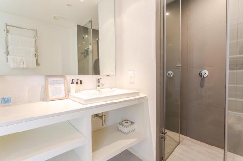 a bathroom with a sink and a shower at 204 Juliette in Cape Town
