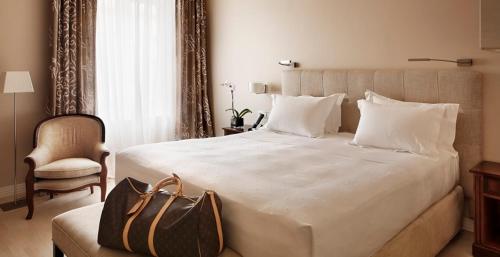 Een bed of bedden in een kamer bij Hotel Rector