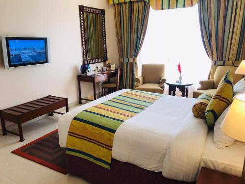 Ένα ή περισσότερα κρεβάτια σε δωμάτιο στο Beach Luxury Hotel