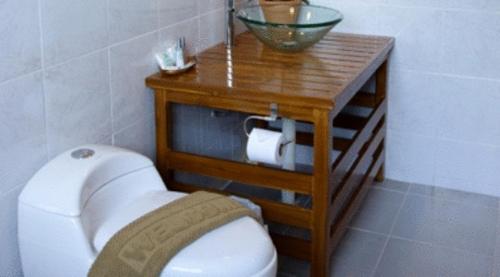 a bathroom with a sink and a toilet in a room at Krabi Home Town Boutique in Krabi town