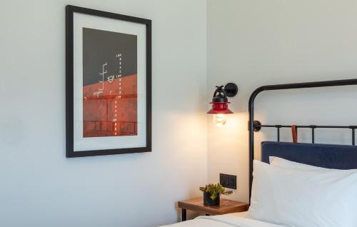a bedroom with a bed and a picture on the wall at Hammetts Hotel in Newport