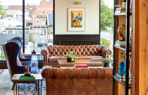 a living room with a couch and a table at Hammetts Hotel in Newport
