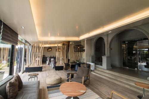 a living room with a couch and a table at Mikelina Boutique Hotel in Pallíni