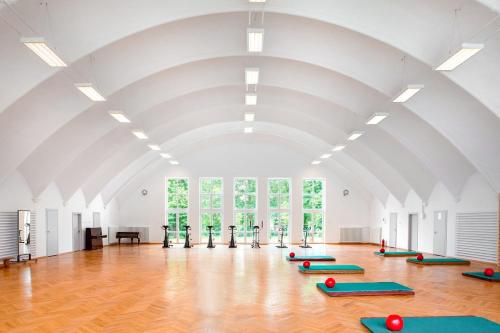 a large room with a row of yoga mats at Biały Dom in Konstancin-Jeziorna