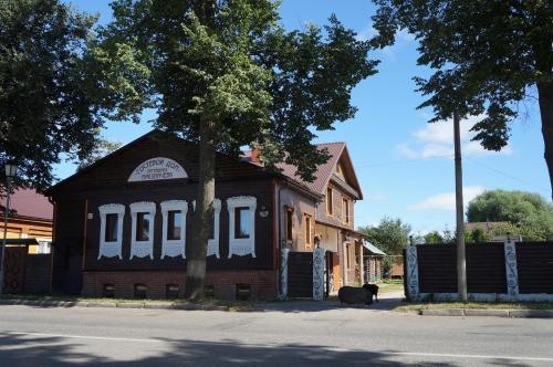 a building with a black bear standing in front of it at House Liteyschika Nikulicheva with Banya in Suzdal