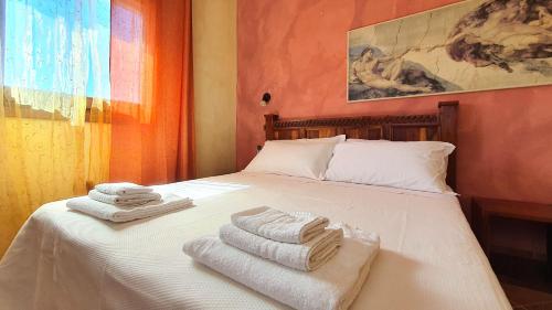 Ένα ή περισσότερα κρεβάτια σε δωμάτιο στο Welcomely - Casa Ginestra