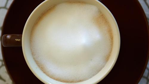 a cup of coffee sitting on a table at la Casa del Vino - B&B in Tollo