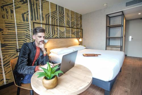 Кровать или кровати в номере Ibis Tours Centre Giraudeau