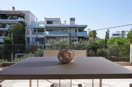 a table with a ball on top of it at Elaia Luxury Apartments Glyfada in Athens