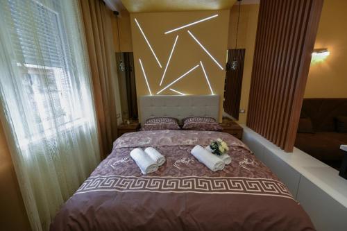 Postel nebo postele na pokoji v ubytování Bane Apartmani 2