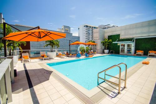 a swimming pool on the roof of a building at Iberostar Berkeley Shore Hotel in Miami Beach