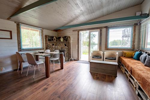 a living room with a couch and a table at Villa Kultaa in Kotka