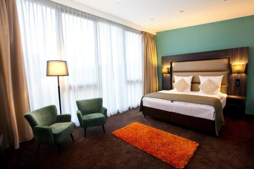 Postelja oz. postelje v sobi nastanitve Centro Hotel Ayun DELUXE