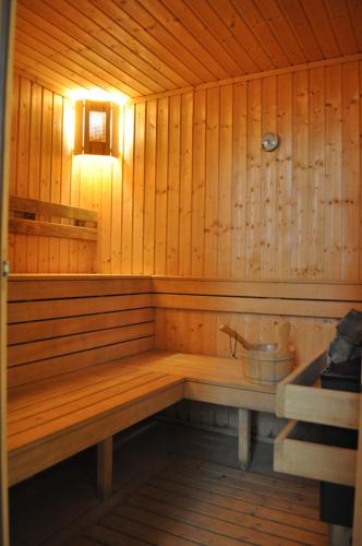 a sauna with a tub with a bucket in it at Wonderful family villa with sea view in Byala