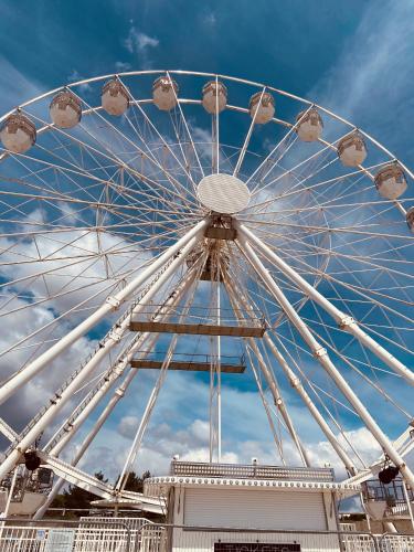 a large ferris wheel against a blue sky at The Boho - 4 min walk to beach & town in Bournemouth