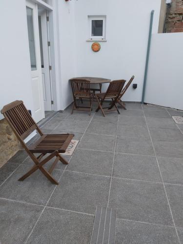 a patio with chairs and a table in a room at Magdalene's City House Inn in Larnaka