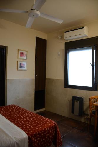 Ένα ή περισσότερα κρεβάτια σε δωμάτιο στο Hotel Santa Cruz
