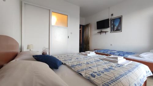 Postel nebo postele na pokoji v ubytování Guesthouse Podaca