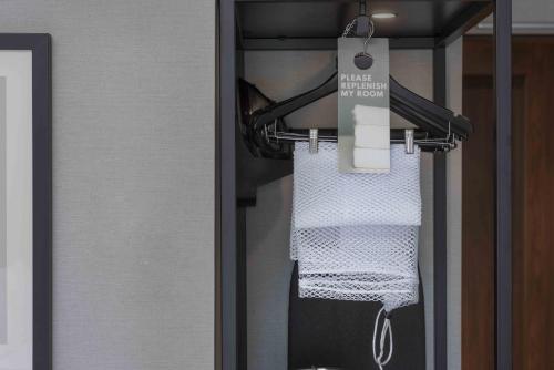 a towel hanging from a rack in a bathroom at Staybridge Suites - Boston Logan Airport - Revere by IHG in Revere