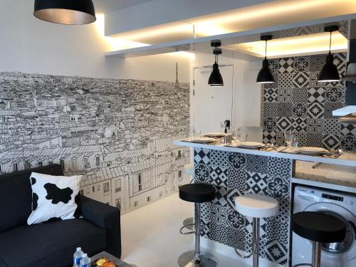 Virtuvė arba virtuvėlė apgyvendinimo įstaigoje Appartement Hainaut Paris XIXème- Tout Equipé!