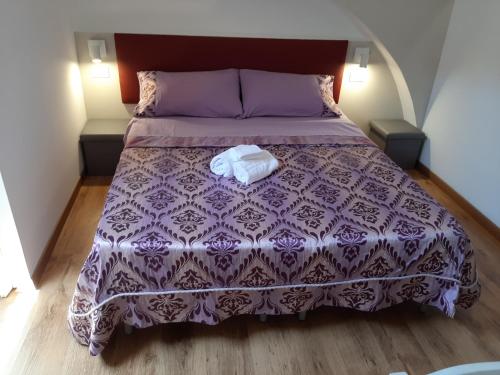 Una cama o camas en una habitación de Sabbia del Sud Affittacamere