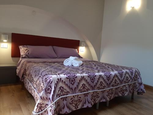Una cama o camas en una habitación de Sabbia del Sud Affittacamere