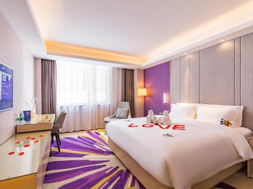 Postel nebo postele na pokoji v ubytování Lavede Hotel Sanhe Yanjiao Tianyang Plaza