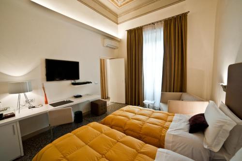 A bed or beds in a room at Town House Cavour