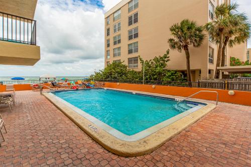 a swimming pool in the middle of a building at 104 Las Brisas Condo in St. Pete Beach