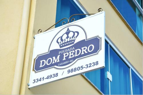 a sign on a building that reads dont perdor at Pousada Dom Pedro in Caxambu