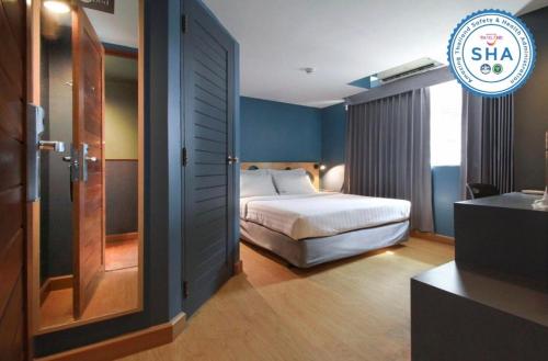 Postel nebo postele na pokoji v ubytování MyBed Ratchada