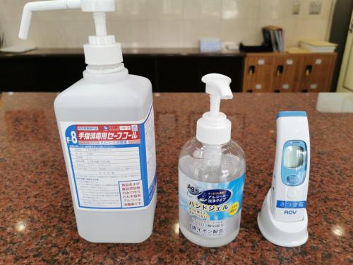 two bottles of laundry detergent sitting on a counter at Hotel Satsukien in Kanoya