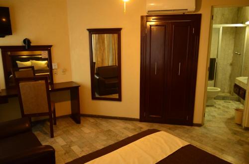 Postel nebo postele na pokoji v ubytování Hotel Flamingo Kristal