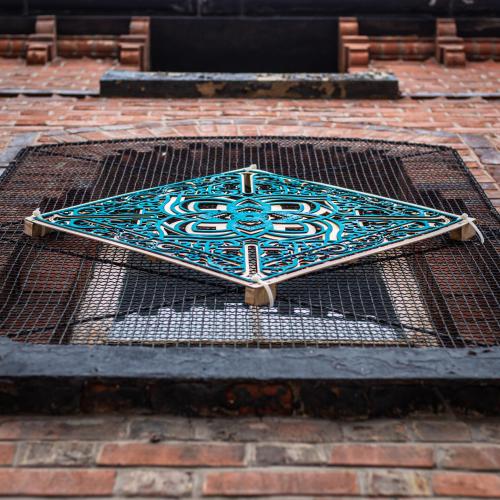 a metal grate with a stained glassagonalagonalagonalagonalagonalagonal at The Baltic Hotel in Liverpool