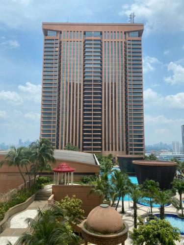 a view of a tall building with a resort at Jenet Service Suite At Times Square KL in Kuala Lumpur