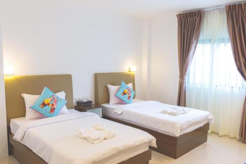 Ένα ή περισσότερα κρεβάτια σε δωμάτιο στο B.S Boutique Hotel
